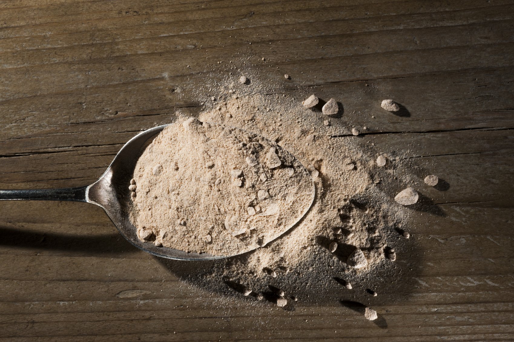a spoonful of chocolate protein powder