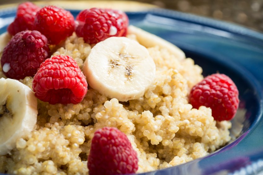 Quinoa breakfast bowl with fresh raspberries and bananas