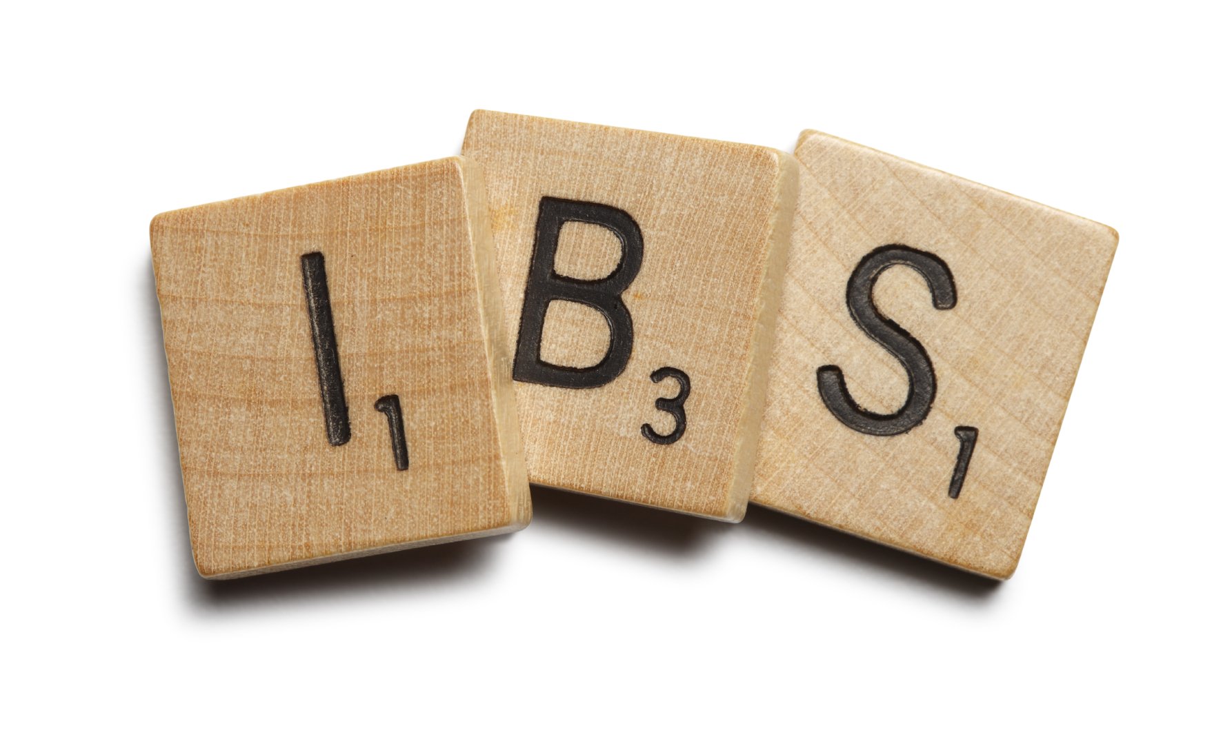 Wooden scrabble tiles spelling "IBS" - for editorial use only