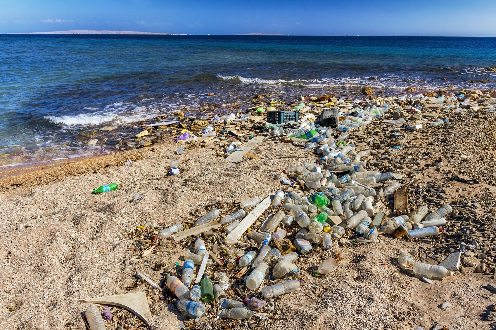 Garbage in the Beach and beautiful seascape in background, Egypt, Red Sea